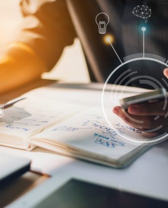 businessman-analyzing-company-financial-report-with-augmented-reality-graphics